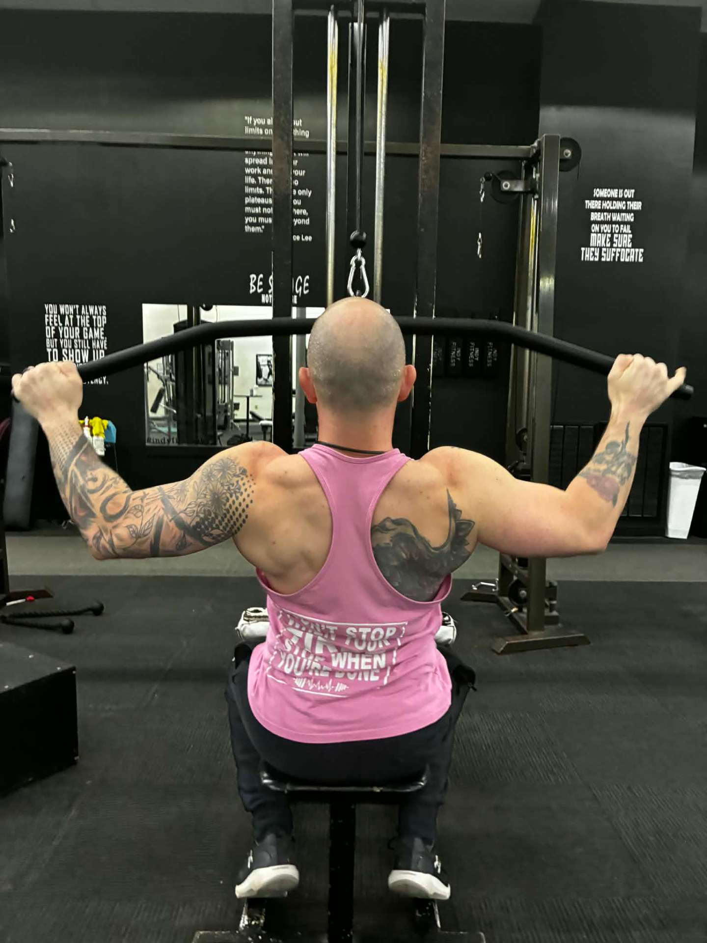 Devon Packett training on a cable lat pulldown